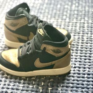 Jordan mid sneakers.  Literally worn once inside for his bday